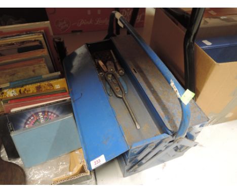 A vintage tool box with contents