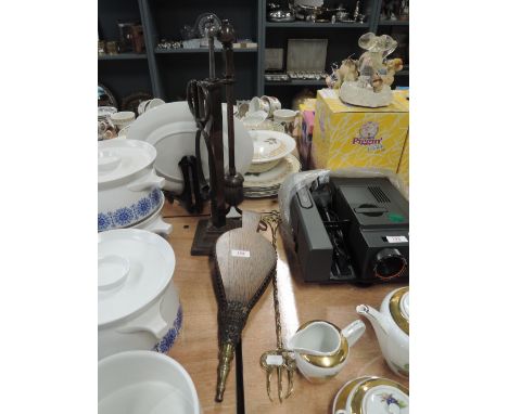 A vintage fire side companion set with bellows and toasting fork