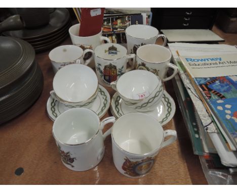 A selection of vintage coronation mugs and modern postcards
