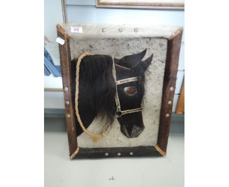 A vintage horse picture made from various furs and animal skins