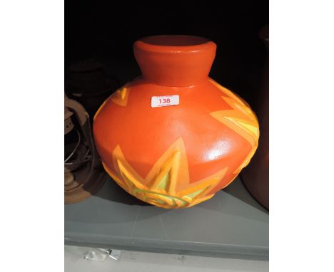 A modern ceramic large squat vase with vivid orange and yellow design