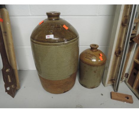 A vintage earthen ware salt glazed advertising flagon for Banks and son's and Jas Harrison Grocer Kendal