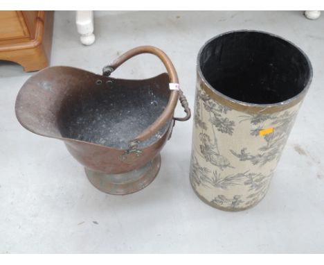 A copper coal helmet and vintage waste bin