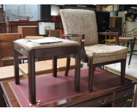 A vintage armchair and a tapestry work stool
