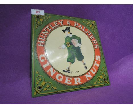 A vintage tin and enamel shop display advertisement for Huntly and Palmers Ginger Nuts
