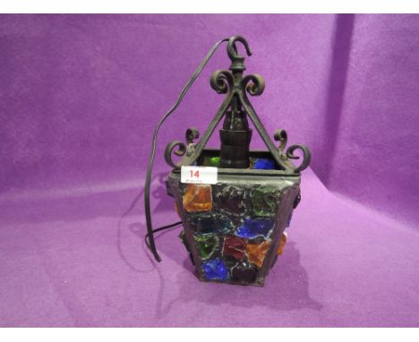 A vintage heavy leaded and colour glass outside or hall way light fitting