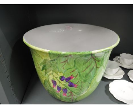 A large hand decorated ceramic planter 
