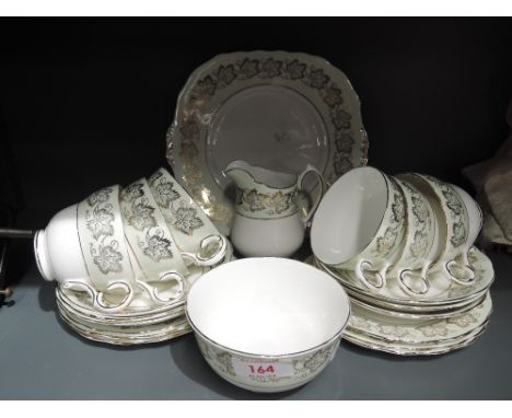A part tea service by Melba bone china transfer print with gilt