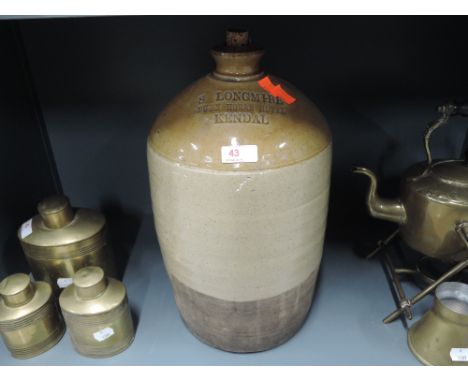 A vintage earthen ware salt glazed advertising flagon for Dunn Horse Hotel, Kendal