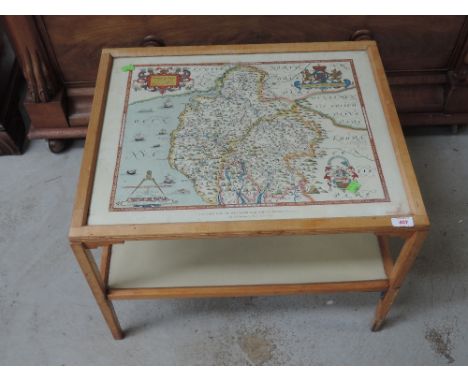 A vintage coffee table having reproduction Saxtons map of Westmorland and Cumberland