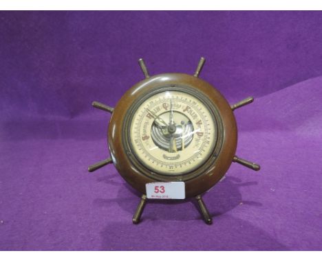 A vintage barometer "Lorioter" in the form of a ships wheel