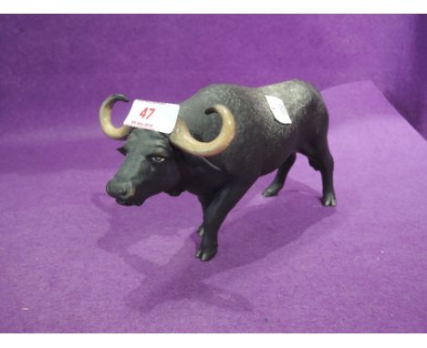 A vintage figurine study of a water buffalo by Coalport