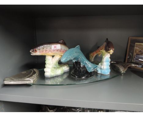 A selection of ceramic fish studies including Poole and glass fish tray