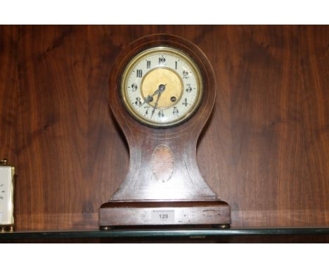 A MAHOGANY INLAID MANTEL CLOCK