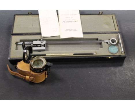 A BOXED STANLEY PLANIMETER TOGETHER WITH MILITARY STYLE COMPASS IN LEATHER CASE
