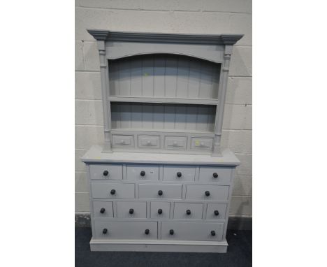 A GREY PAINTED NARROW CHEST OF FOURTEEN DRAWERS, width 122cm x depth 28cm x 90cm, and a painted dresser top with a single she