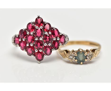 TWO GEM SET RINGS, the first a large marquise shape ring set with sixteen oval cut garnets, each in a shared claw setting, si