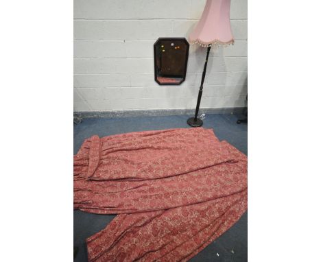 A RECANGULAR WALL MIRROR, with canted corners, a standard lamp, two pairs of red floral curtains, drop 210cm, four tie backs,