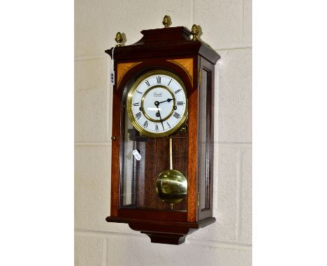 A COMITTI OF LONDON WALL CLOCK, Westminster chimes with pendulum and key, white chapter ring and black Roman numerals, mahoga