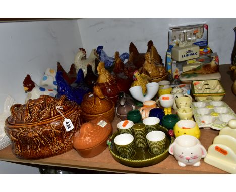 A GROUP OF CHICKEN AND EGG THEMED CERAMICS, to include thirteen hen on nest dishes, by makers including Portmeirion, three si