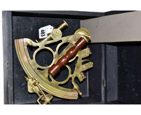 A Reproduction brass Sextant in a wooden box together with an Aristo Studio slide rule (1)