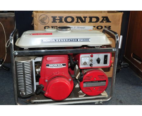 A HONDA E1500 GENORATOR in original box with original instruction manual (UNTESTED but engine pulling freely)