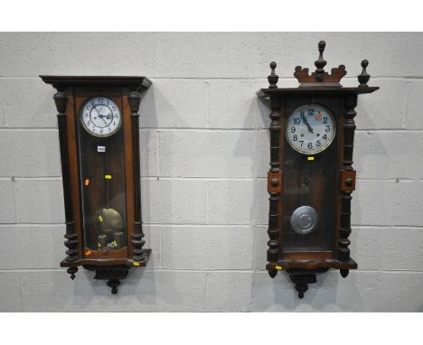 A LATE 19TH CENTURY WALNUT VIENNA WALL CLOCK, half turned fluted pillars to the door, enclosing an enamel dial with Arabic nu