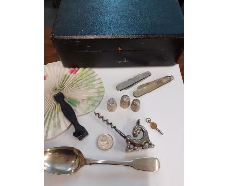 A small lot comprising a Georgian silver tablespoon 41g, a fan, a vintage corkscrew in the form of a donkey, three thimbles t