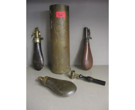 Two leather and brass 19th century powder flasks, one by G &amp; JW Hawksley, a leather and steel powder flask, a brass powde