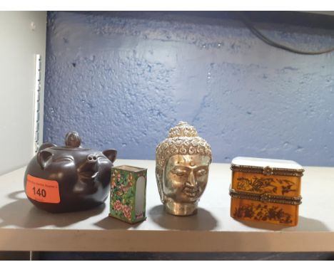 A group of Oriental items to include a small brown pottery teapot and a silver coloured Buddha headLocation: 9.1 