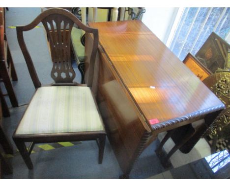 A 1920's mahogany drop leaf table standing on ball and claw feet, 75cm h x 91cm w together with a set of four early 20th cent