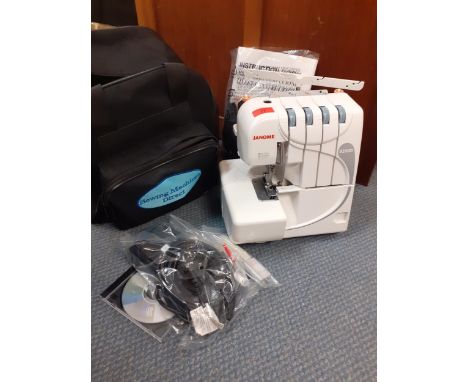 A modern Janome sewing machine model 9200D in carrying case with accessories and boxed cotton reels, manual and CD Location: 