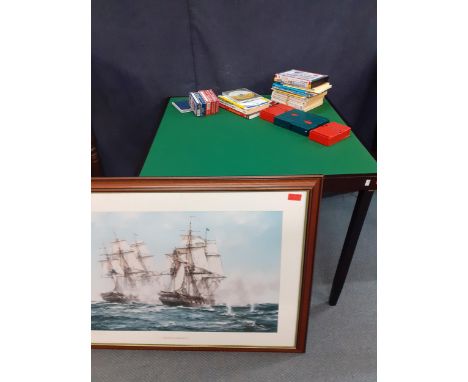 A folding games table with green felt top, Bridge card game accessories, and a large framed print of HMS Java and USS Constit