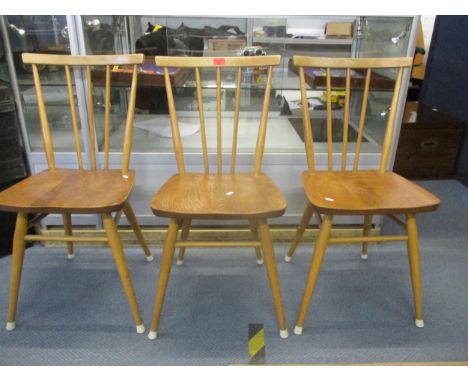 A set of three Ercol 391 stick back chairs in elm and beech, remains of label to back of two chairsLocation: 