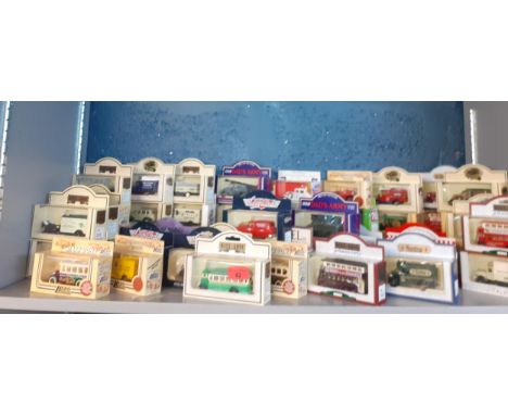 A collection of boxed die cast vehicles, mainly vintage vans and buses to include Lledo, Days Gone, Dad's Army and VanguardLo