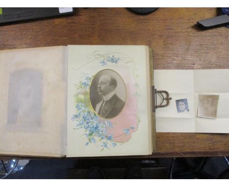 A Victorian photograph album containing various portrait photographs, Location: A1F 