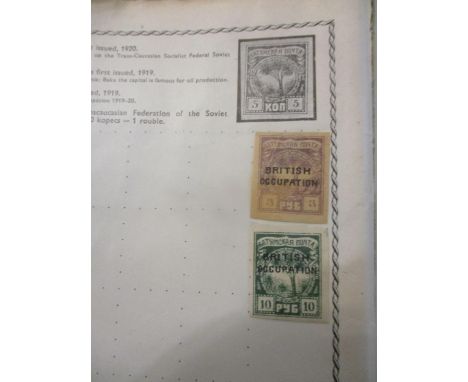 The Triumph and The Wanderer stamp albums containing stamps from around the world including British and Commonwealth stamps, 