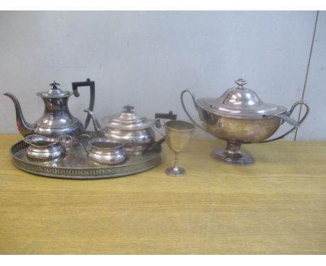 Silver plate to include a navette shaped soup tureen and ladle, a four piece tea service, on tray with inscription and a trop