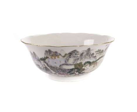 A Republican Period early 20th century Chinese porcelain bowl, of lobed form and decorated with a hill top landscape with bui