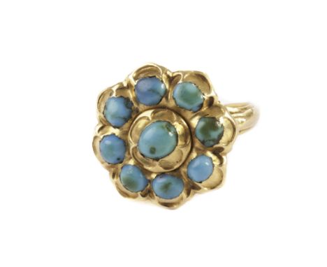 An antique gold and turquoise dress ring, the large cluster style tablet set with turquoise beads with domed back on tulip st