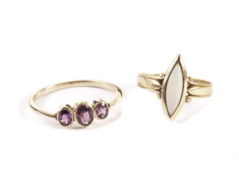 Two vintage gold and gem set rings, one with a navette shape cut opal, the other with three oval garnets (2) 