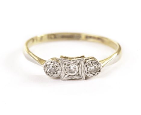 An Art Deco three stone diamond ring, the old cuts in platinum illusion set tablet on an 18ct gold band 