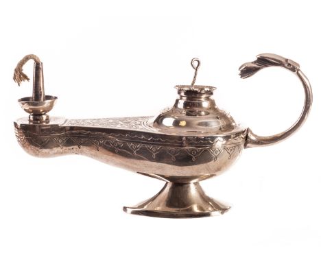 A Middle Eastern white metal oil lamp table lighter, having engraved script to upper with a stylised bird head finial to hand