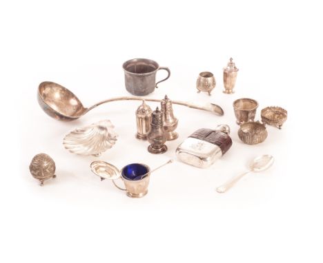 A collection of silver and silver plated items, including a silver shell butter dish, a pair of pepperettes, a set of three s