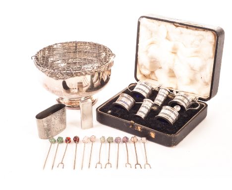 A George V silver cased set of cruets, including a pair of peppers, mustards and salts with glass liners and spoons, together