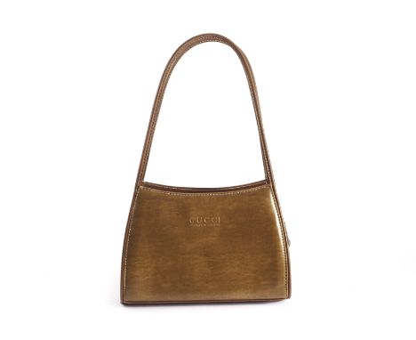 A designer brown leather lady’s handbag, marked GUCCI - MADE IN ITALY to the front 24.5cm W We cannot commit to an opinion on