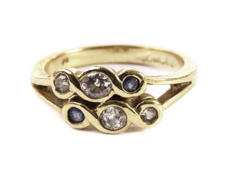 A sapphire and diamond modern dress ring, having a double tablet of three stones, unmarked 