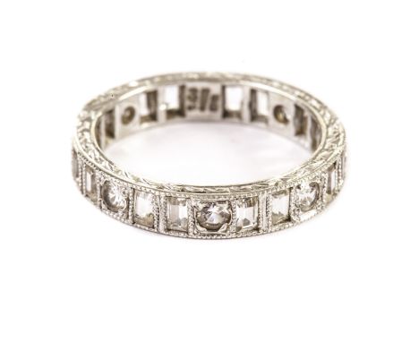 A 9ct white gold eternity ring, with round and baguette cut white stones, size P 