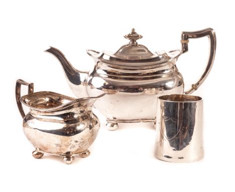 A George V silver teapot and milk jug by Henry Adams, dated Sheffield 1914 & 1912, together with a small silver tankard comme