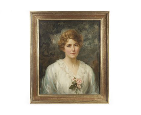 An early 20th century oil on canvas portrait, of a society lady with cropped hair holding a rose, indistinctly signed upper l